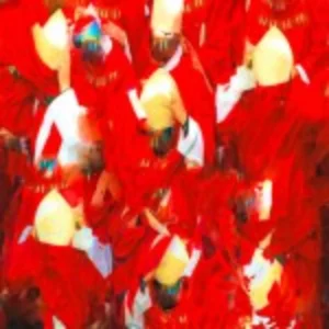 Several people wearing red and white attire, gathered closely, smiling and engaging with one another.