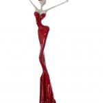 A red and white sculpture depicting a woman in an elegant pose, showcasing artistic craftsmanship and design.