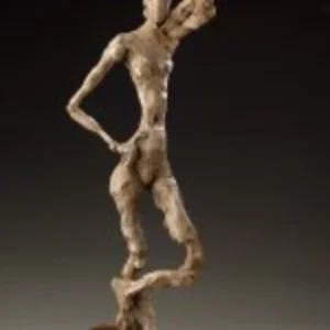 A graceful sculpture of a woman with her arms extended outward, representing joy and liberation.