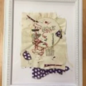 A wall-mounted frame displays an artistic representation of a person, highlighting their features and character.