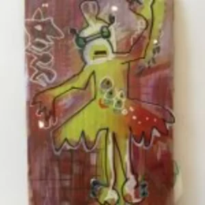 A colorful mural featuring a girl with a skateboard, set against a rustic wall background.